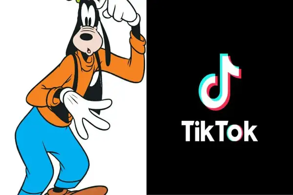 Goofy w pomarańczowej bluzie i niebieskich spodniach, obok logo TikTok. Goofy ahh, jakby tańczył do viralowego trendu.