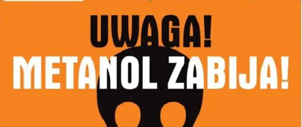 Uwaga! Metanol w winie zabija! Czarna czaszka na pomarańczowym tle ostrzega przed śmiertelnym zagrożeniem.
