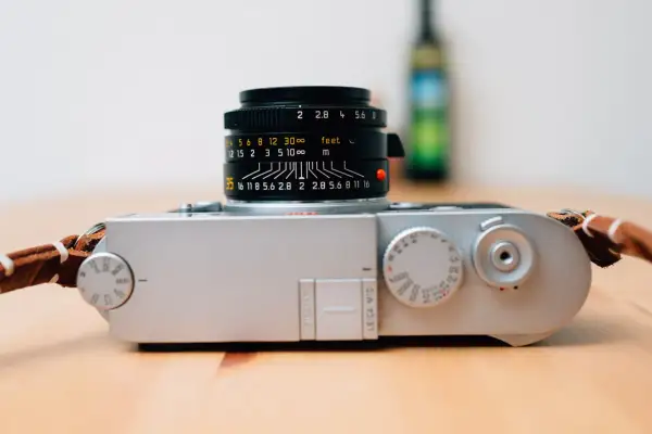 A silver Leica M10 camera with a black Leica Summicron lens attached, ready for capturing timeless moments.