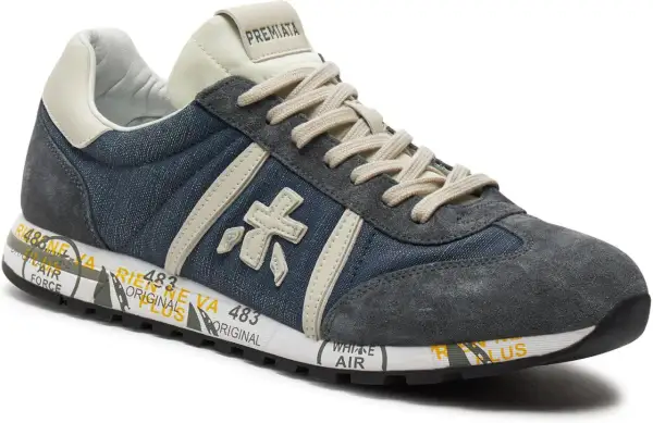 Buty Premiata, znana włoska marka, prezentują stylowe sneakersy z denimu i zamszu.