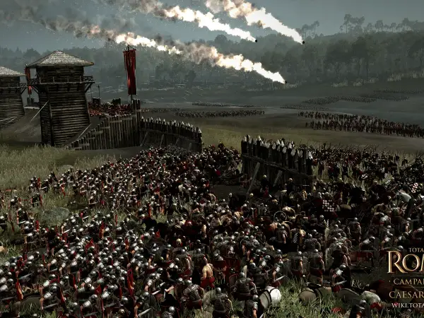 La batalla de Alesia en pleno apogeo. Legiones romanas asedian una fortaleza gala, con fuego y humo en el cielo.