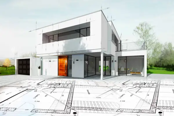 Moderner Hausentwurf mit Bauplänen im Vordergrund. Die enev bedeutung zeigt sich in der detaillierten Planung des energieeffizienten Gebäudes.