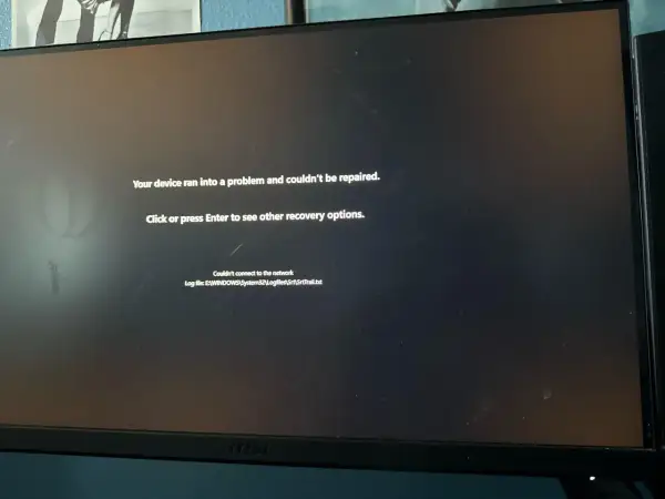 Ekran komputera z komunikatem błędu "Your device ran into a problem and couldn't be repaired.