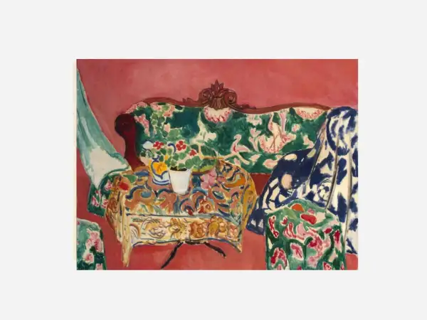 A vibrant interior scene by Matisse, capturing the joy of life with a floral sofa, patterned tablecloth, and a vase of flowers.