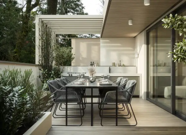 Moderne terrasse gestalten mit Essbereich und Außenküche, umgeben von üppigem Grün. Perfekt für entspannte Abende.