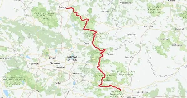 Mapa z zaznaczoną na czerwono trasą rowerową Szlak Orlich Gniazd, biegnącą przez malownicze tereny Jury Krakowsko-Częstochowskiej.