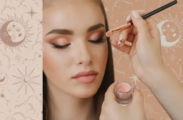 Guida per imparare come fare un make up perfetto: applicazione di ombretto scintillante con pennello su un occhio di una modella.