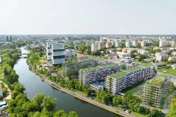 Nowoczesne osiedle apartamentowe z zielonymi dachami nad rzeką w Bydgoszczy.