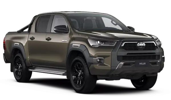Brązowy Toyota Hilux z czarnymi felgami i relingami. Sprawdź aktualną toyota hilux cena i zamów swój wymarzony samochód.