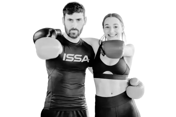 A man and woman in boxing gloves ready to punch, embodying the intensity of hiit boxing.