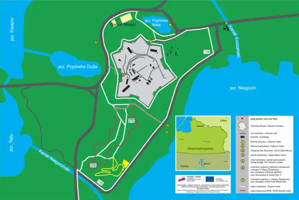 Mapa Giżycka z trasami rowerowymi, w tym szlakami MTB, prowadzącymi przez tereny Twierdzy Boyen i okolice jezior.