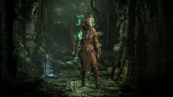 Postacie z Diablo 4 w zbroi z zielonymi, świecącymi elementami, stojące w ruinach świątyni.