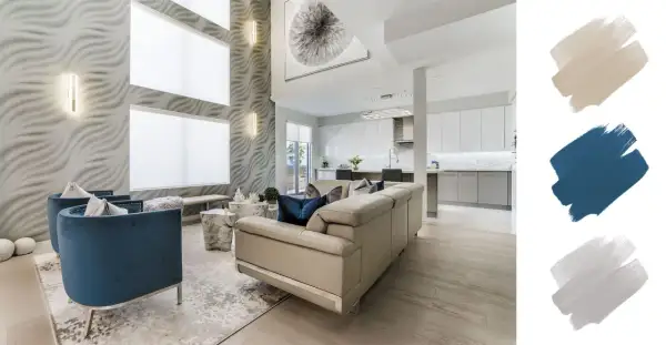 A modern living room with a textured wall, blue velvet chairs, and a cream sofa. The interior design color schemes feature beige, navy, and grey swatches.