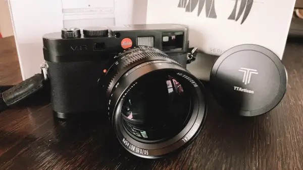 Leica M8 camera with a TTArtisan 50mm f/0.95 lens. The lens has "50/0.95" clearly visible.