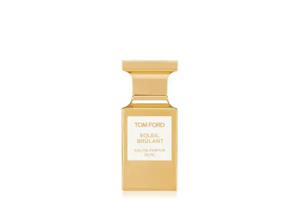 Złota butelka perfum Tom Ford Soleil Brûlant, emanująca ciepłem i luksusem.