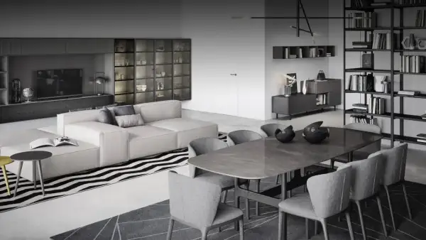 Stilvoller Wohn- und Essbereich mit moderner Trennung: Ein beiges Sofa und ein Esstisch mit grauen Stühlen schaffen eine elegante Atmosphäre.
