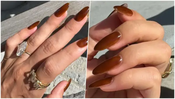 Manucure marron élégante sur des ongles longs et pointus, ornés de bagues scintillantes.