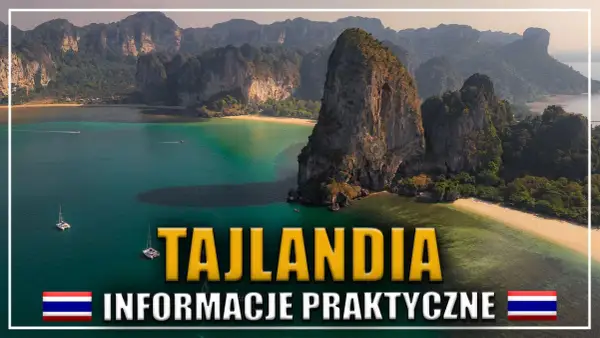 Tajlandia: jak zaplanować podróż marzeń? Widok na turkusową zatokę z wapiennymi klifami i łodziami. Praktyczne informacje dla podróżujących.