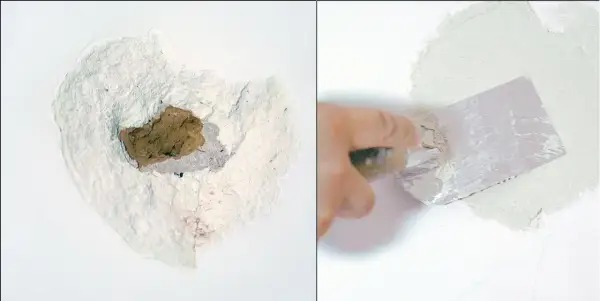 Naprawa dużych ubytków w ścianie wewnętrznej: uszkodzona tynkowana powierzchnia i ręka z kielnią nakładająca gładź.