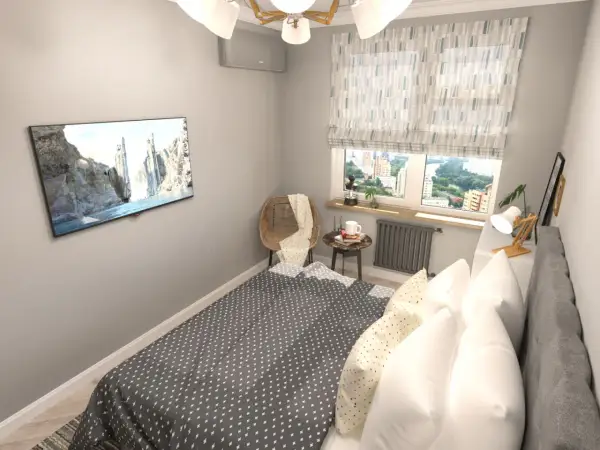 Gemütliches Schlafzimmer mit Bett, Fernseher und Fensterblick. Tolle Schlafzimmer Ideen für kleine Räume.