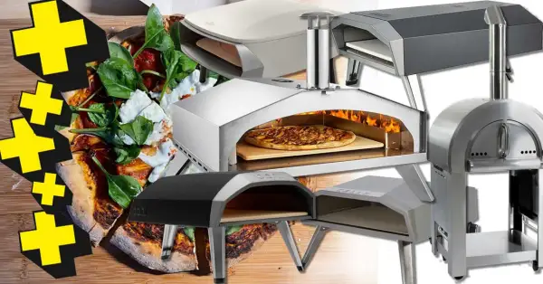 En samling pizzaugnar för grillen, redo för ett fcc bbq pizzaugn test. En pizza med färska ingredienser syns i förgrunden.