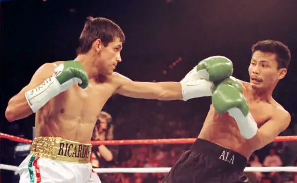 Boxer Ricardo "Finito" Lopez lands a punch in a light flyweight bout.