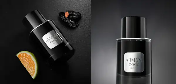 Eleganckie perfumy męskie Armani Code Elixir w czarnej butelce, obok pomarańczy i daktyli.