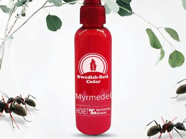 Röd flaska med "Myrmedel" och "Swedish-Red Cedar" text. Myror i rabatten, men denna produkt hjälper mot dem.