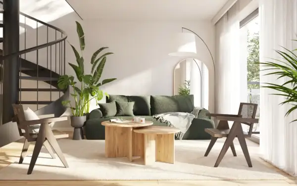 Nowoczesny salon z zieloną sofą i drewnianymi meblami. Idealne miejsce na wakacyjny **wynajem apartamentów nad morzem**.