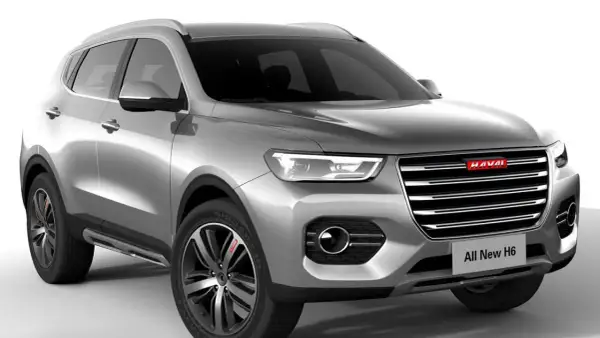 Srebrny SUV Haval All New H6 z chromowanymi detalami i nowoczesnymi światłami.