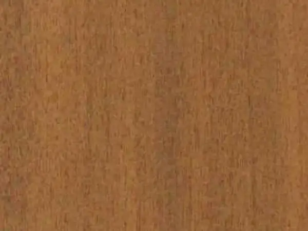 Textura de madera de mansonia, con vetas finas y un tono marrón rojizo cálido.