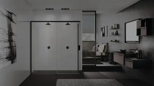 Un elegante bagno in camera con doccia doppia, lavabo sospeso e letto visibile attraverso uno specchio.