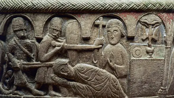 Stenrelief med en scen som påminner om martyriet av **Saint Sebastian**. Soldater förbereder sig, en man ligger ner, och en annan håller ett kors.