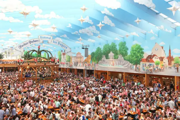 Folla festante in una tenda decorata con cielo azzurro e nuvole, un'autentica scena delle **tedesche Oktoberfest**.
