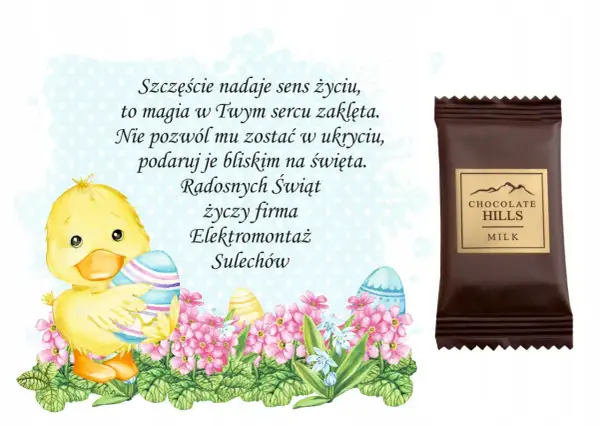 Uroczy kurczaczek z pisankami i kwiatami, obok czekoladka "Chocolate Hills". Wesołych Świąt życzy firma Elektromontaż Sulechów.