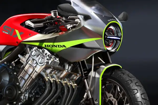 Motocykl Honda z silnikiem 6-cylindrowym, czerwony bak z napisem SIX, srebrne owiewki z zielonymi akcentami.
