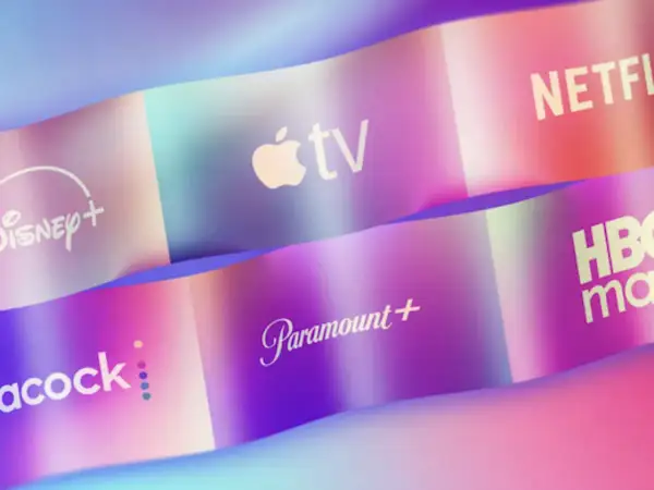Logos of streaming services like Disney+, Apple TV, Netflix, Peacock, Paramount+, and HBO Max are displayed on colorful, wavy ribbons, showcasing the variety of what is online video.