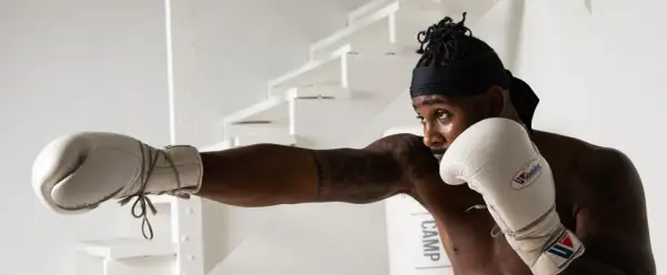 A boxer throws a punch, showcasing the precision and strategy that makes boxing the sweet science.