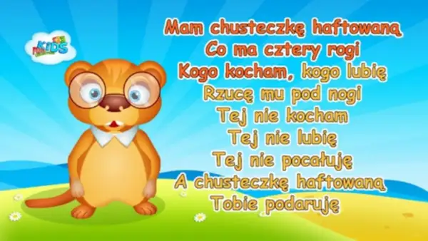 Uroczy, okularowy bóbr śpiewa piosenkę "Mam chusteczkę haftowaną" na tle błękitnego nieba i zielonej łąki.