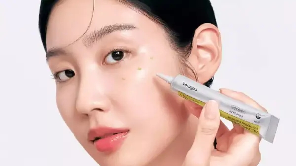 Une femme applique un sérum sur son visage. Le tube indique "RETINAL", suggérant une discussion sur la différence entre rétinol et rétinal.