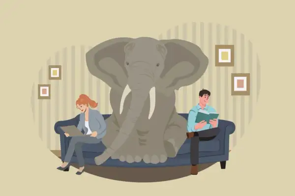 Un elefante en la habitación, un ejemplo de **idioms with animals**. Dos personas leen en un sofá, ignorando al paquidermo.