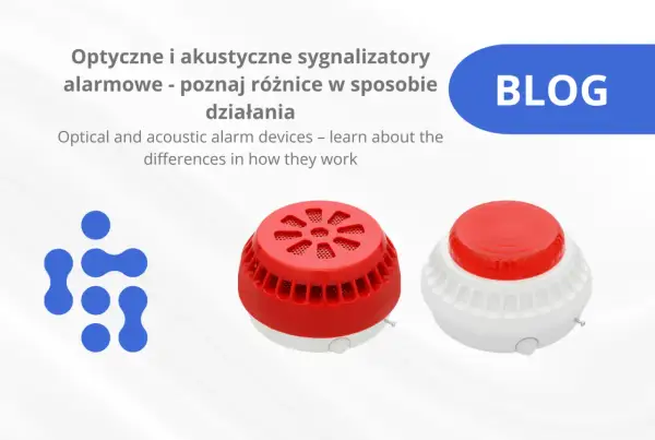 Dwa sygnalizatory akustyczno optyczne, jeden czerwony, drugi biało-czerwony, obok niebieskiego logo.