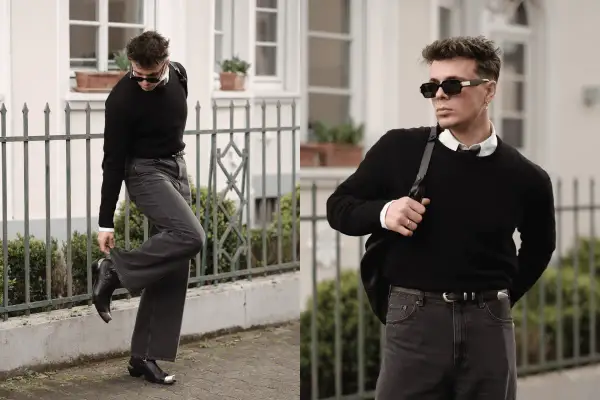 Mann in schwarzem Pullover, weißem Hemd und dunkler Hose, bereit für ein Techno-Festival. Coole Sonnenbrille und Stiefel runden den Look ab.