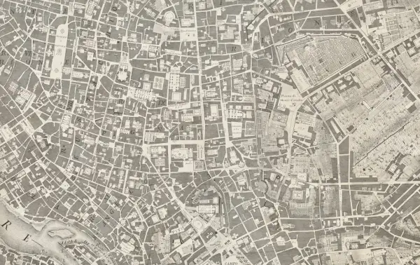 Stary plan miasta, przypominający miejscowy plan zagospodarowania przestrzennego, ukazuje gęstą sieć ulic i budynków.