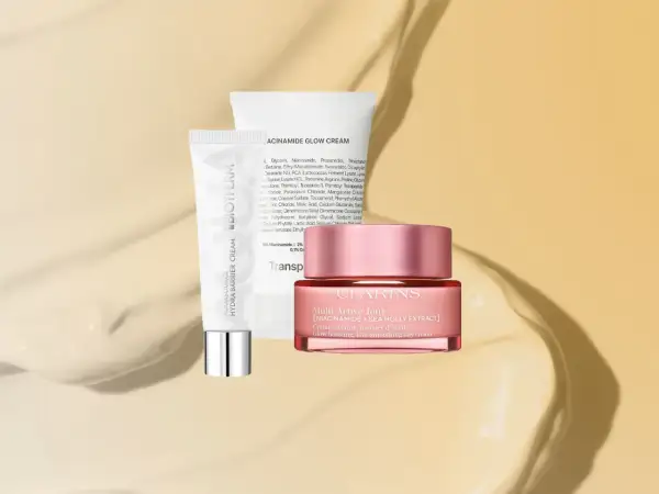 Zwei Hautpflegeprodukte: eine Tube Biotherm Aquasource Hydra Barrier Cream und ein Tiegel Clarins Multi-Active Jour. Beide sind reichhaltige feuchtigkeitscremes für strahlende Haut.