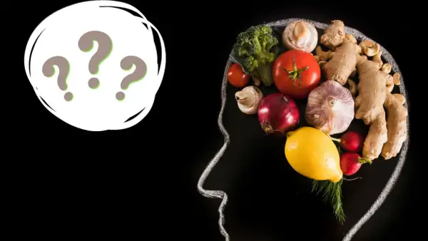 Psychodietetyk czym się zajmuje? Zdrowa dieta wpływa na mózg, co pokazuje kompozycja warzyw i owoców w zarysie głowy.