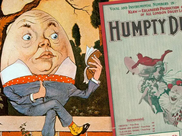 Humpty Dumpty siedzi, czyta książkę. Obok plakat "Humpty Dumpty" z diabłem i klaunem. Królu mój tekst.
