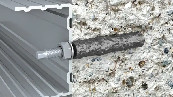 Przekrój kotwy chemicznej w betonie i profilu aluminiowym.