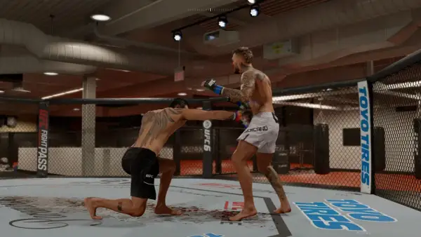 Two fighters in a UFC octagon. One fighter is on one knee, throwing a punch, showcasing advanced boxing combinations.