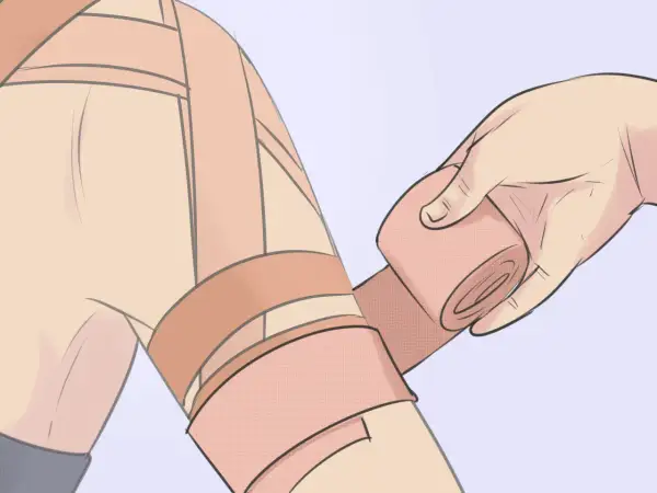 Application d'un strap pour soulager une tendinite à l'épaule.